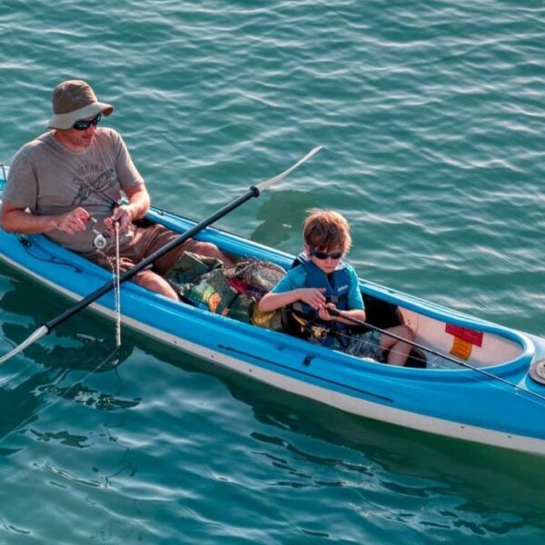 Fishing Father and son fishing from a kayak