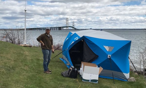 Researchers used a tent to house important equipment and attached the radar unit to a temporary stand during tests. Photo by Guy Meadows, Michigan Tech. University.