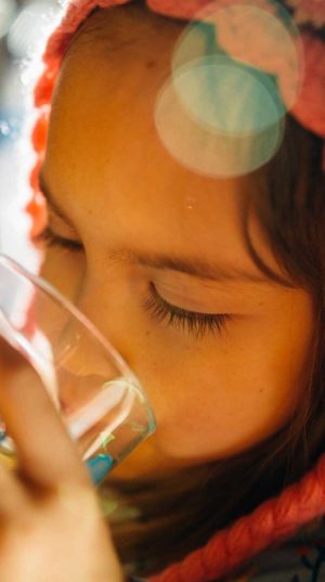 Little girl drinking clean water