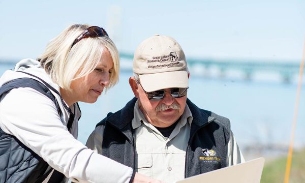 Lorelle and Guy Meadows inspect high frequency radar from the Straights of Mackinac