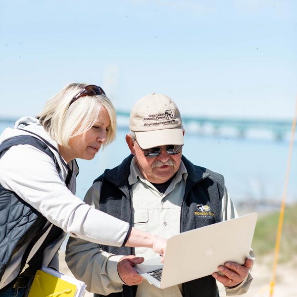 Lorelle and Guy Meadows inspect high frequency radar from the Straights of Mackinac
