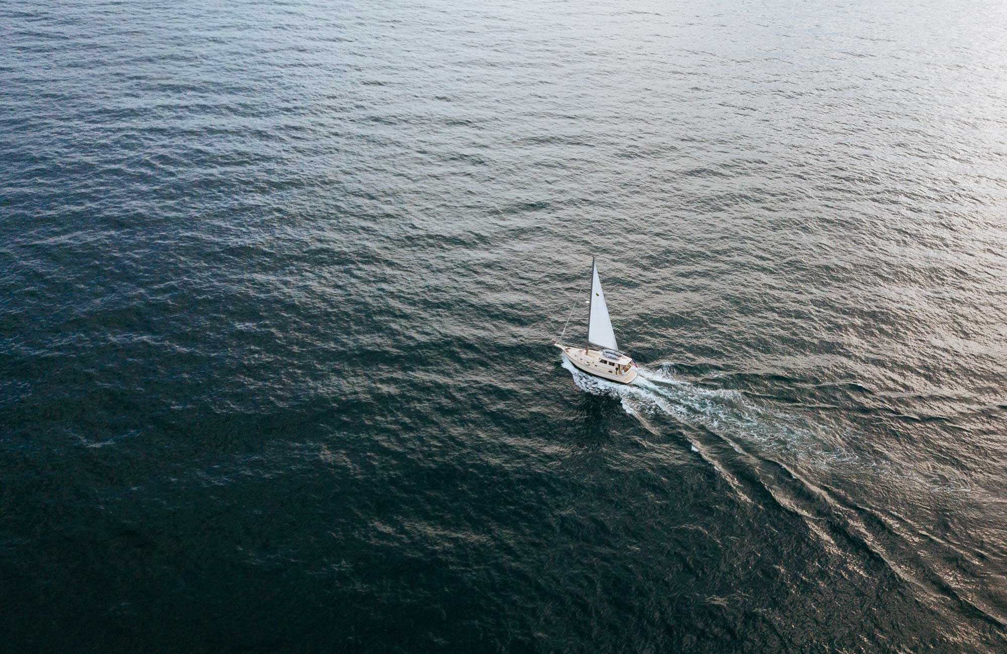 Ariel shot of a sailboat in the lake